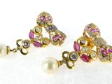 a pair of pink and white pearls and gold earrings