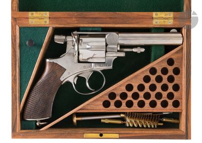 the gun is in a wooden box with a green cover