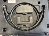 an image of a close up of a hose connected to a gas tank
