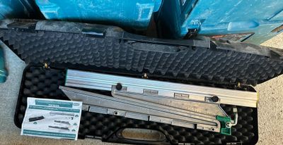 a case with tools in it sitting on the floor