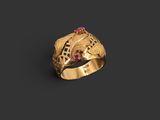 a gold ring with a ruby stone in the center