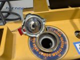 a close up of a yellow fire hydrant on a table