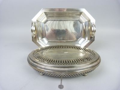 an antique silver plate with a mirror on top of it