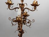a lamp that is on a stand with a bird on top of it