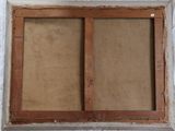 a close up of an old window with a wooden frame
