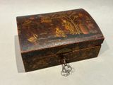 a small wooden box with a lock on it