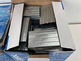 a box full of metal staples on a table