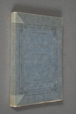 an old book with a blue cover sitting on top of a table