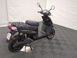a scooter that is parked in a garage