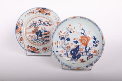 pair of blue and orange plates with flowers and birds on them