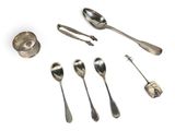 several silver spoons and spoon spoons on a white surface