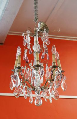 a chandelier hanging from the ceiling in a room