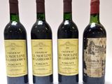 trois bouteilles de vin sont alignées sur une surface blanche