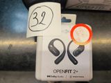 two ear buds that are attached to a sign