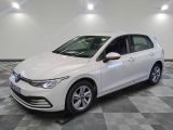 the white volkswagen e - golf is parked on a checkered tile floor