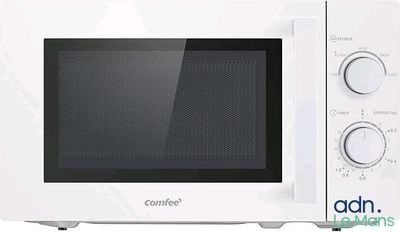 a white microwave that is sitting on a white table