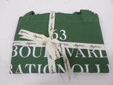 a green napkin with a white ribbon tied to it