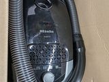 a box with a vacuum and a hose in it