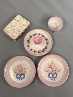 four plates and two cups on the table