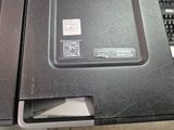 a close up of a laptop and a keyboard on a desk
