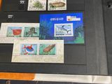 a binder with a lot of stamps on it on a table