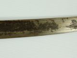 a knife that is on a table with a white table cloth