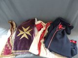 several pieces of clothing are laid out on a bed