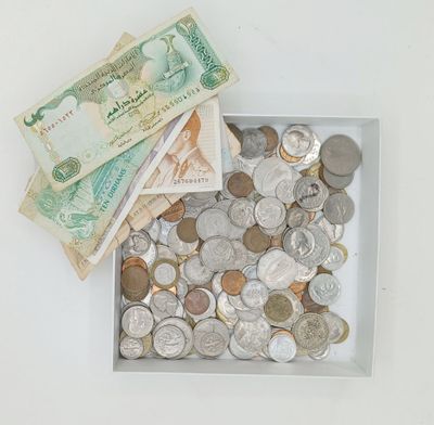 a box full of coins and money sitting on a table