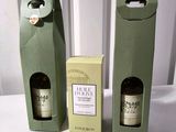 two bottles of wine that are sitting next to each other