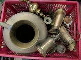 a pink basket filled with different types of metal items