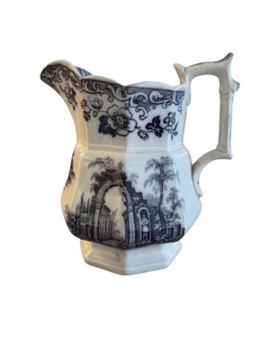 an image of a blue and white pitcher on a white background