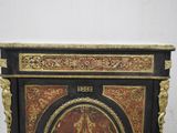 a black and gold cabinet with a clock on top of it