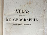 a white book with black writing on it sitting on a table