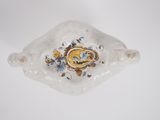 a small glass bowl with a decorative design on it