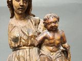 statue of a woman holding a child on her lap