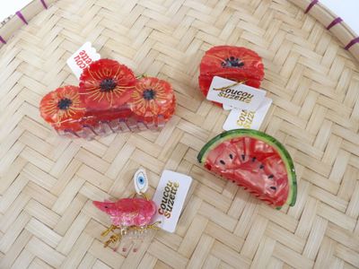 three pieces of watermelon and a slice of watermelon on the table