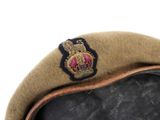 a brown hat with a crown on top of it