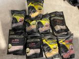 many bags of food that are sitting on the floor