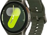 a smart watch with a green face and yellow hands