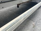 a close up of a flatbed truck with a flat bed underneath it