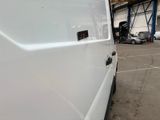 a white van that is parked in a parking lot