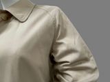 an image of a woman ' s shirt and tie on a mannequin head