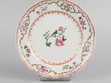 an image of a plate with a bird and flowers on it
