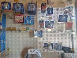 many different types of tires on the wall in this store