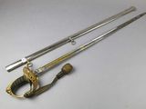 two swords and a sword on a white surface