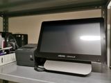a desktop computer sitting on a shelf in a room