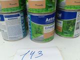 a group of cans of paint sitting on top of a table