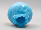 an image of a blue glass skull on a white surface