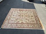 a large rug on the ground in the parking lot
