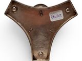 a close up of a metal object with a tag on it